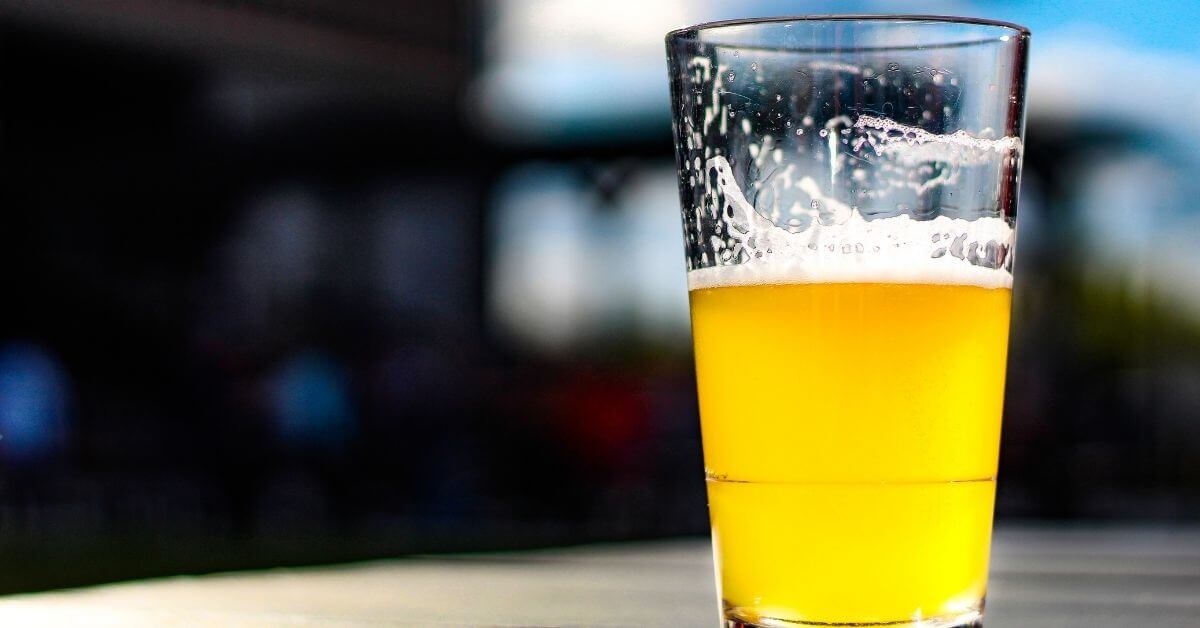A lager beer sits on a Chicago patio table